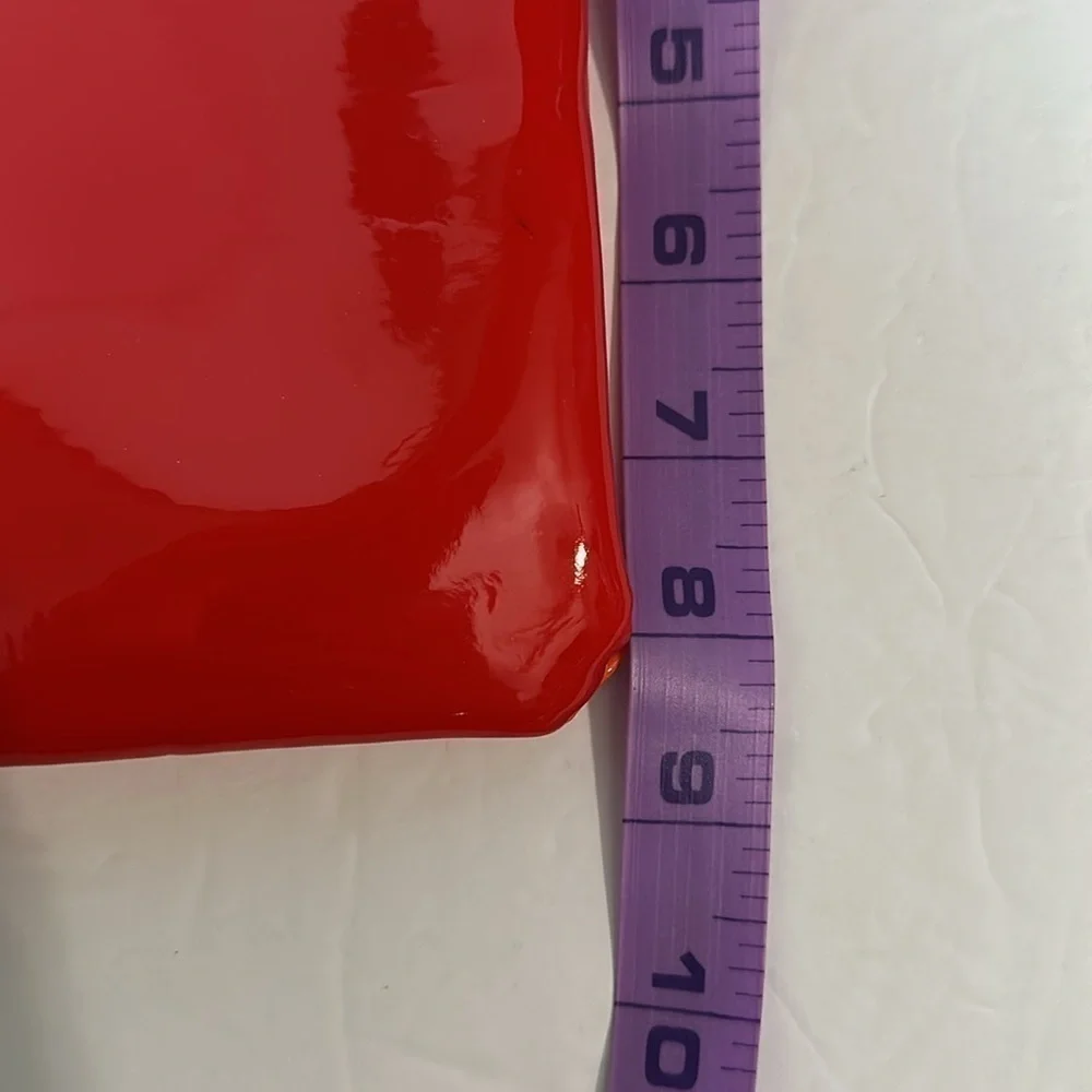 The Revlon x Megan Thee Stallion makeup bag with oversized zipper
